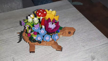 Load and play video in Gallery viewer, 477PCS Turtle Animal Building Block Set, suitable for Youngsters 6 7 8 9 10 years old and above, boys and girls toys, with flower pot turtle building block model, cute structure, birthday gift, Valentines Day gift
